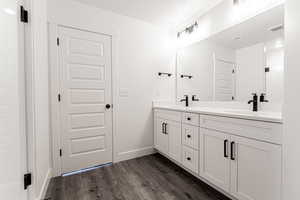 Bathroom featuring hardwood / wood-style floors and vanity