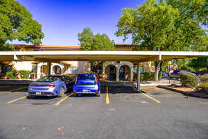 View of car parking featuring a carport