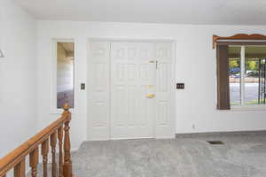 View of carpeted foyer entrance