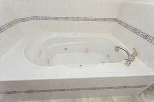 Bathroom with tiled tub