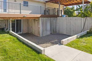 View of patio with a wooden deck