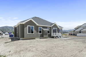 Back of property featuring a mountain view