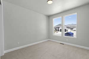 Carpeted spare room with a mountain view