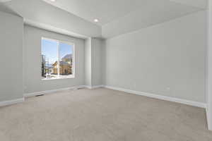 Unfurnished room with light colored carpet