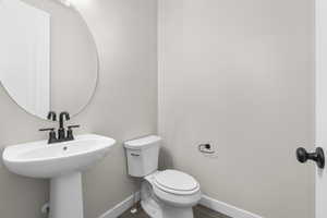 Bathroom with wood-type flooring and toilet