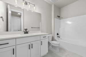 Full bathroom with vanity, toilet, and tub / shower combination