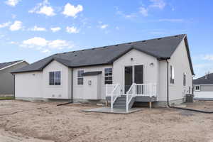 Rear view of property featuring central air condition unit