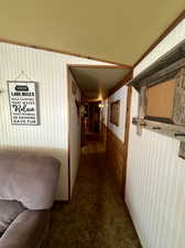 Corridor with dark colored carpet