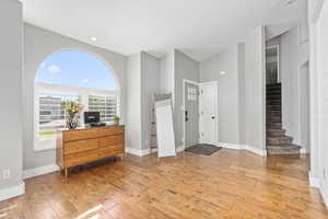 Entrance foyer with light wood-type flooring