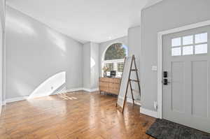 Foyer entrance featuring hardwood / wood-style floors