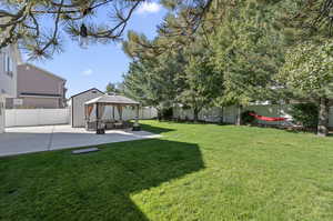 View of yard featuring a gazebo and a patio