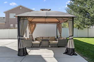 View of patio / terrace featuring an outdoor living space and a gazebo