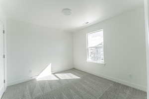 Unfurnished room featuring carpet