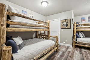 Bedroom with wood-type flooring and a textured ceiling