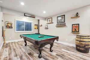 Game room featuring hardwood / wood-style flooring and pool table