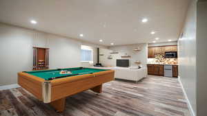 Recreation room featuring baseboards, visible vents, wood finished floors, and recessed lighting