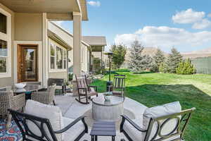 View of patio featuring a mountain view and an outdoor hangout area