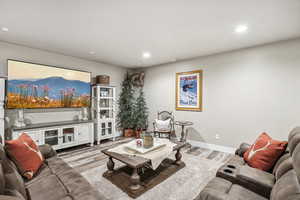 Living room with light wood-type flooring