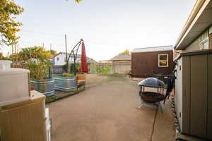 View of patio / terrace featuring a storage unit