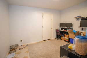 Office area featuring light colored carpet