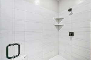 Bathroom with a shower with shower door