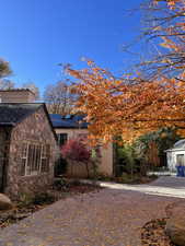 View of property exterior featuring solar panels