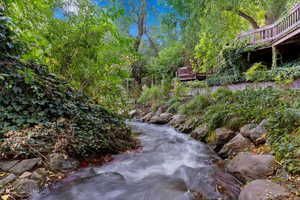 View of creek looking up to the upper yard and deck