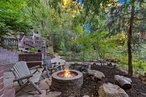 View of outdoor fire pit along creek