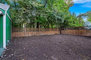 View of garden behind detached garage. Could be the future site of a detached ADU.