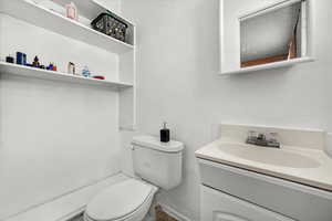 Bathroom with vanity and toilet