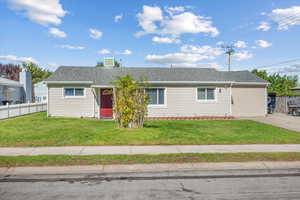 Single story home featuring a front yard and cooling unit