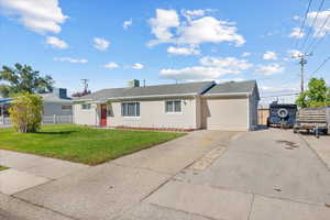 Single story home with a front yard