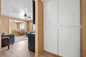 Hall with light hardwood / wood-style floors