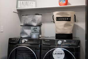 Washroom featuring washing machine and clothes dryer