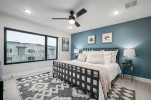 Bedroom featuring ceiling fan and carpet flooring