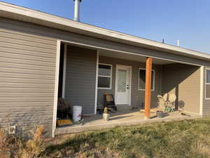 Entrance to property with a patio