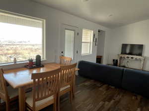 Dining room with dark wood-type flooring