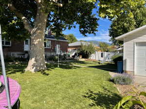 View of yard featuring a garage