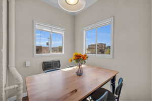 Dining room featuring crown molding and plenty of natural light