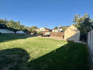 View of yard with a storage shed