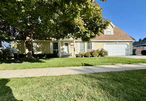 View of front of property with a front lawn