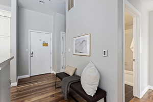 Entrance foyer featuring dark hardwood / wood-style flooring