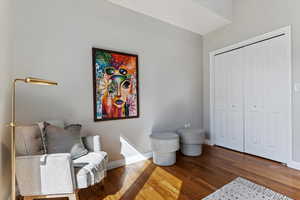 Sitting room with dark hardwood / wood-style floors