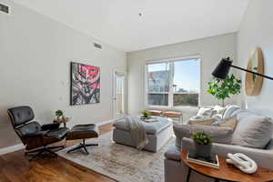 Living room with hardwood / wood-style floors