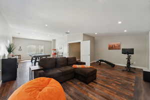 Living room featuring dark hardwood / wood-style flooring