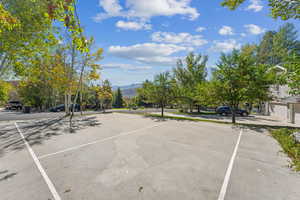 View of parking / parking lot with a mountain view