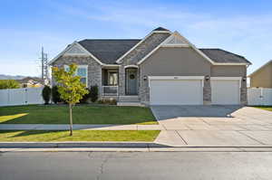 Craftsman-style home featuring a front yard