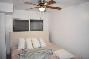 Bedroom with ceiling fan and a closet