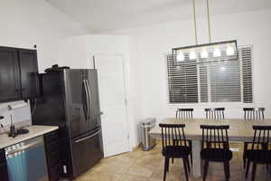 Dining room featuring vaulted ceiling