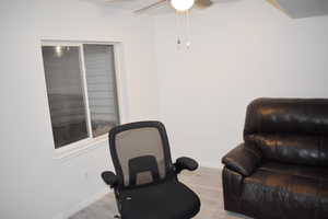 Sitting room featuring ceiling fan and light hardwood / wood-style floors